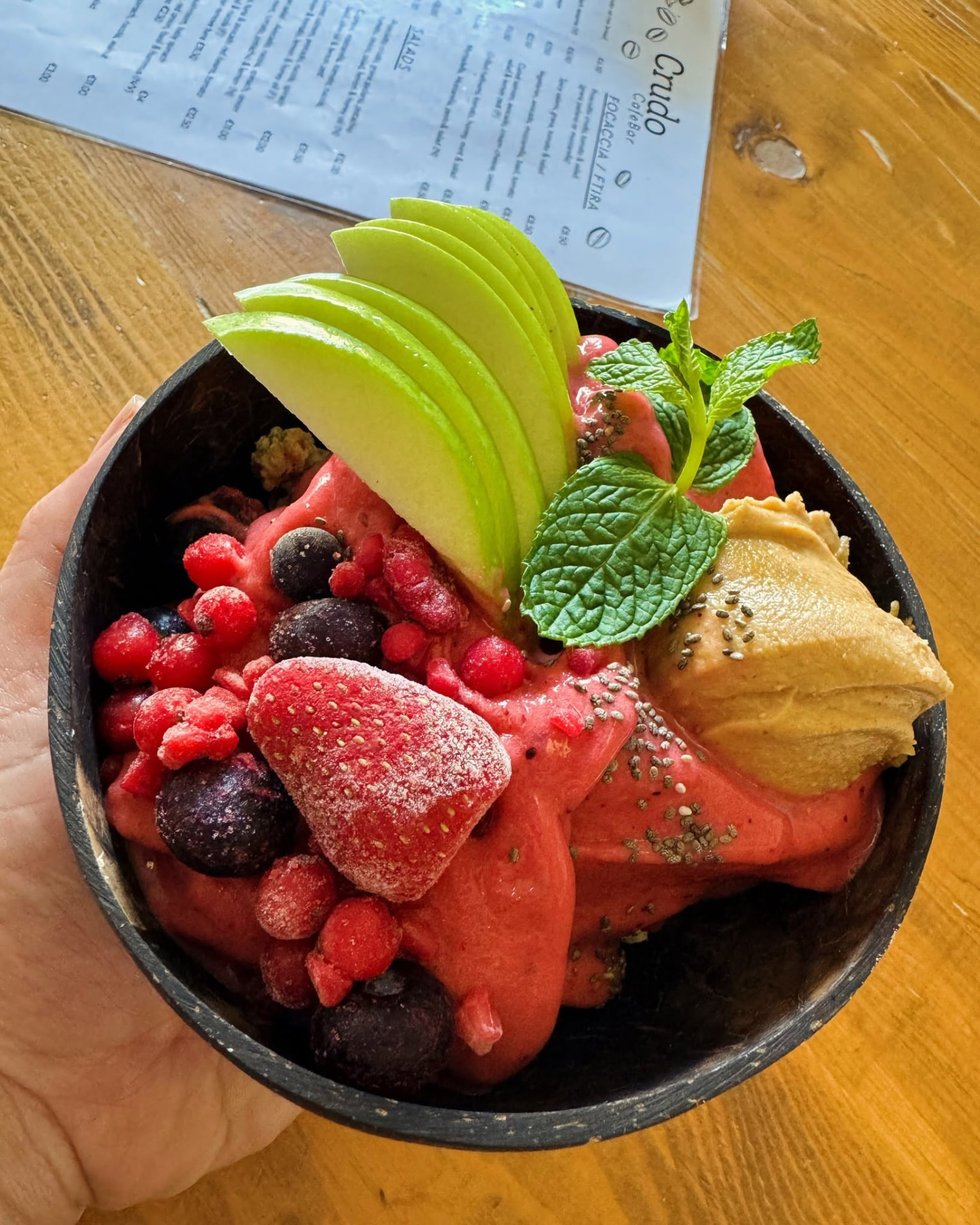 Fresh berry smoothie bowl with apple and nut butter